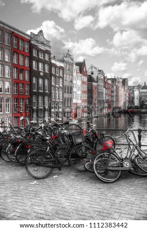 Traditional old buildings in Amsterdam, the Netherlands. black and red and white photo