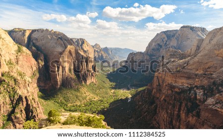 Zion National Park -  hiking in beautiful canyon in summer - amazing landscape scenery with beautiful colors of rock formations