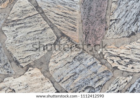 Striped natural stone flooring.