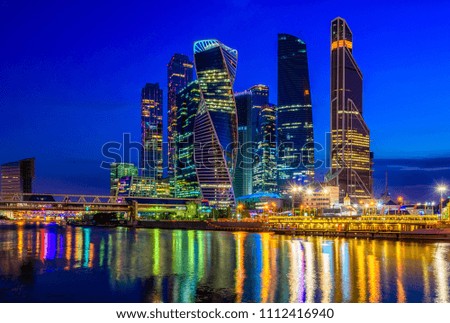 Skyscrapers of Moscow City business center and Moscow river in Moscow at night, Russia. Architecture and landmark of Moscow