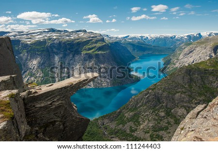 Trolltunga, Troll's tongue rock above lake Ringedalsvatnet, Norway Royalty-Free Stock Photo #111244403