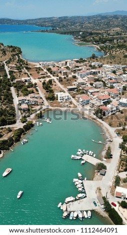 Aerial drone bird's eye view photo of famous and picturesque yacht dock seaside fjord village of Porto Heli with turquoise and emerald clear waters, Argolida, Peloponnese, Greece