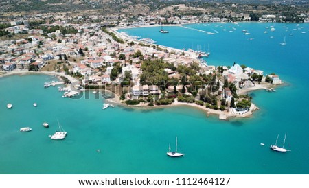 Aerial drone bird's eye view photo of famous and picturesque yacht dock seaside fjord village of Porto Heli with turquoise and emerald clear waters, Argolida, Peloponnese, Greece