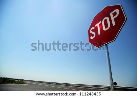 Stop sign by the side of the road