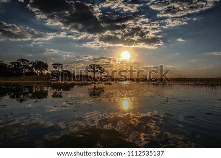 Beautiful sunset and reflection on the Okavango Delta, Botswana