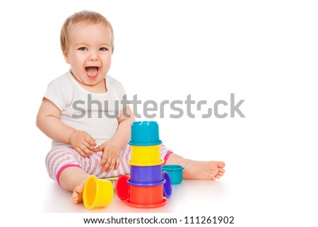Little girl with a toys, isolated on white