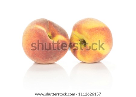 Pair of yellow peaches with a red blush isolated on white background
