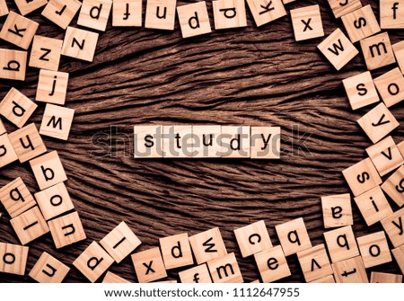 Study word written cube on wooden background. Vintage concept.