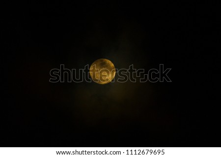 Full Moon with heavy cloud in the night with bright moon light