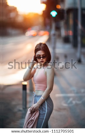 Young girl on street at sunset