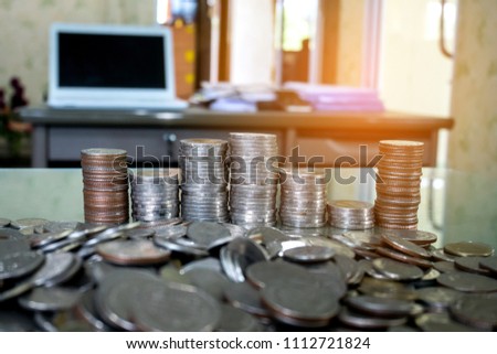 Group of coins  Thai baht on blur background in Business Room.Photo select focus.