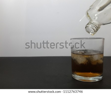 The last drop of alcohol in a glass jar.