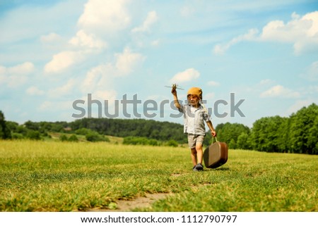 a  boy pilot with airplane