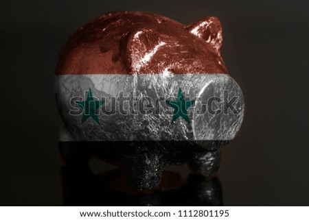 Piggy bank with Flag of Syria on a black background