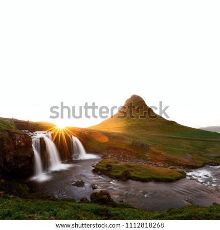 Colorful sunrise on Kirkjufellsfoss waterfall. Amazing morning scene near Kirkjufell volkano, Iceland, Europe. Landscape photography