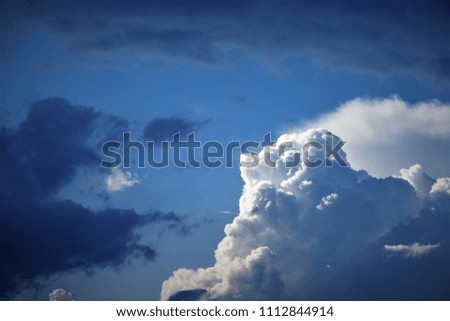 Amazing cumulus clouds on the background of blue sky, Spring in GA USA.