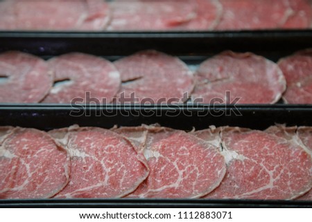 Beef meat slides on dish