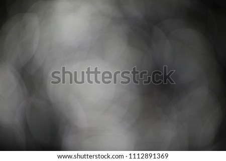 Abstract white bokeh on black background