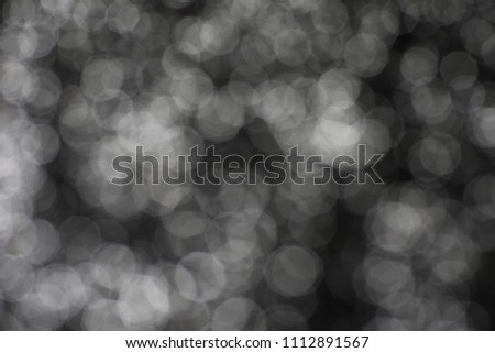 Abstract white bokeh on black background
