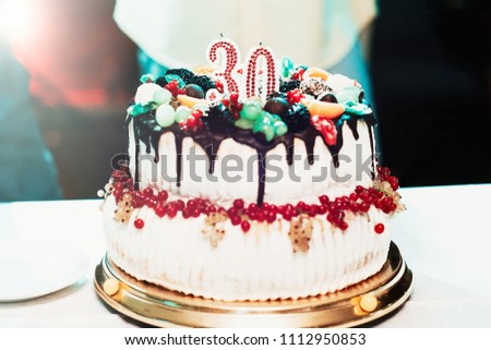 Birthday cake with candles for 30 years