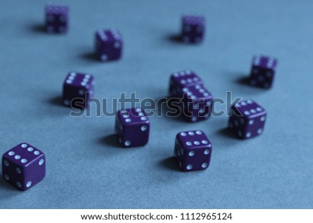 Many purple Die on a gray background
