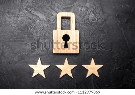 Wooden padlocks and three stars. Security, security of users and business. Internet security, antivirus, data protection. Alarms of home, car and business. The concept of property protection.