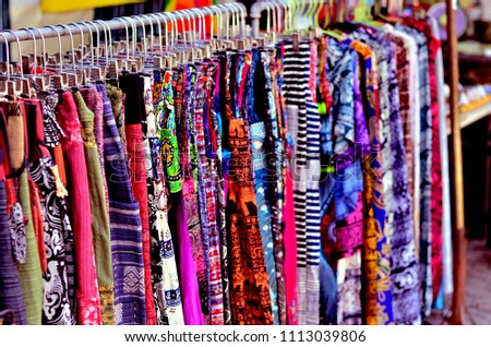 Set of muticolored clothes on khao san road in Bangkok, Thailand (Selective Focus)