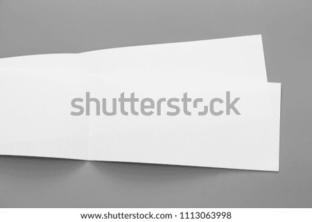 Blank portrait mock-up paper. brochure magazine isolated on gray, changeable background / white flyer paper isolated on gray