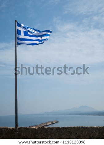 Greek flag by sea