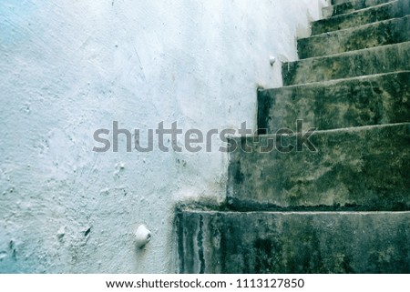 Old Grunge Concrete Stair with White Wall and Space for Text.