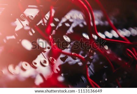 Professional electronic synthesizer board for music composer.Modern studio synth panel for composing musical tracks in high quality.Many dj audio cables connected to analog sound recording device Royalty-Free Stock Photo #1113136649