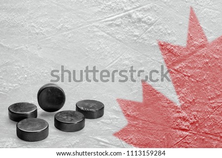 Hockey puck and image on the maple leaf Canadian map. Concept, hockey, background