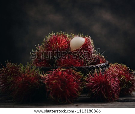 Fresh rambutan on wooden table.Thai fruit.