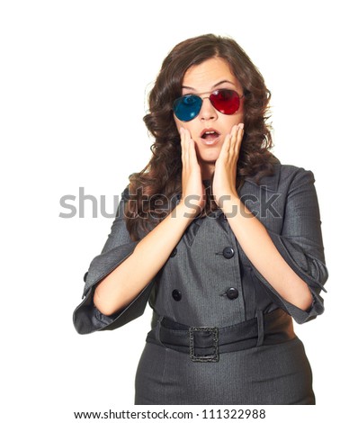 Surprised girl in 3d-glasses with her hands in the face and a gray dress. Isolated on white background