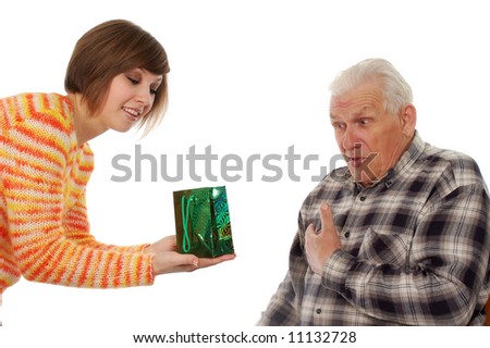 happy grandfather and granddaughter with present. isolated on white