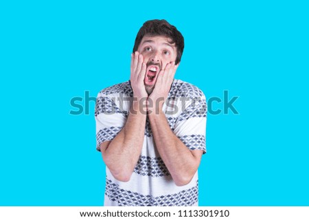 young crazy man scared expression