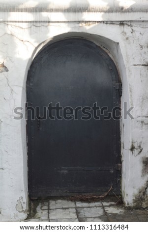 old black metal door