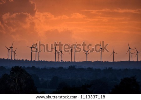 wind turbine over skyline on evening before sunset countryside of Thailand . Royalty-Free Stock Photo #1113337118
