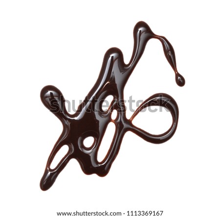 Close up of chocolate syrup leaking on white background