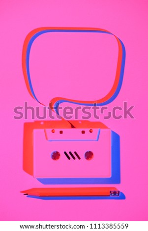 toned pink picture of pencil and retro audio cassette with speech bubble