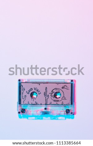 top view of mixtape with good vibes inscription on purple background