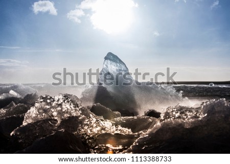 Ice washed up on Iceland black sand beach
