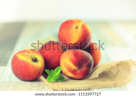 Fresh peaches  on wooden background