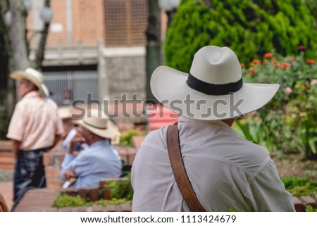 Local people with sombreros in the streets of a village in Colombia Royalty-Free Stock Photo #1113424679