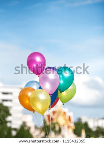 Multi-color balloon with blue sky.