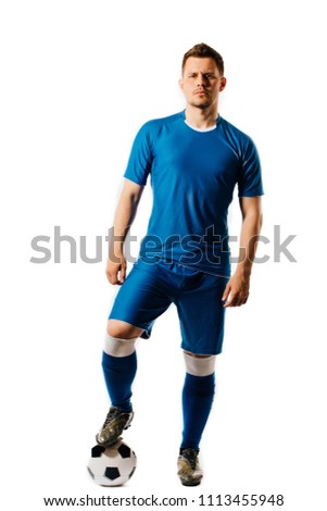 Young handsome football player with a soccer ball posing isolated on white background. in full growth. Royalty-Free Stock Photo #1113455948
