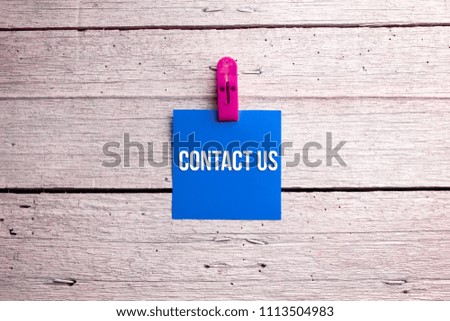 Contact Us text. Business concept for Social Media Marketing written on sticky note paper on wooden background.