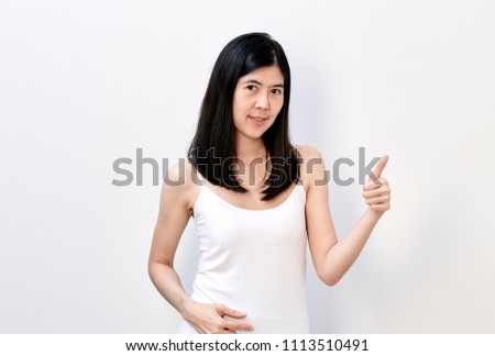 Smiling slender asian woman presenting copyspace on the palms on a white background