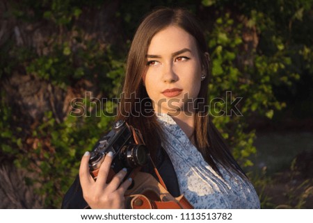Girl with vintarge photo camera