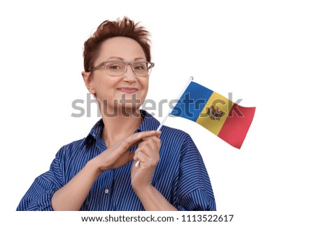 Woman holding flag of Moldova.  Nice portrait of middle aged lady 40 50 years old with a national Moldovan flag isolated on white background. Learning Moldovan language. Visit Moldova concept.